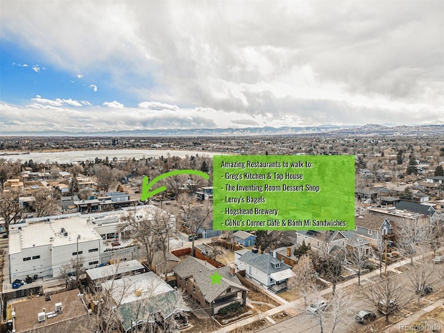 birds eye view of property featuring a mountain view