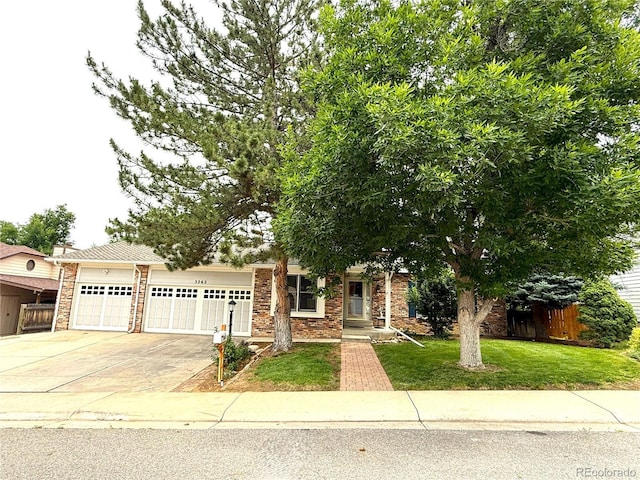 3262 S Salida Way, Aurora, CO 80013 - view of property hidden behind natural elements with a garage and concrete driveway
