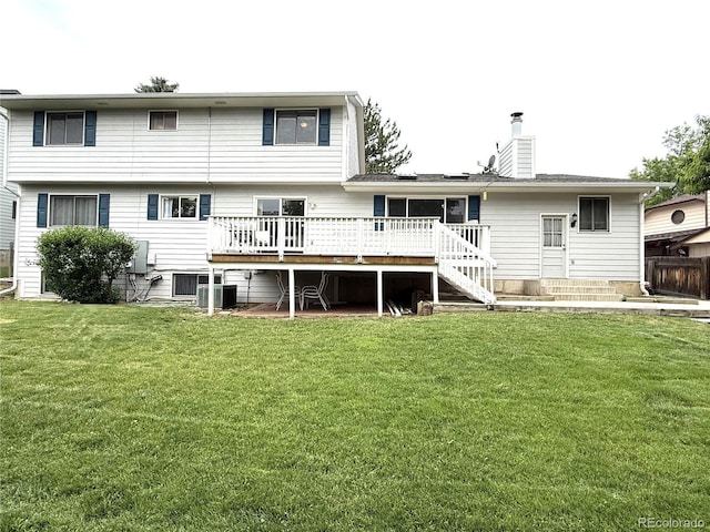 3262 S Salida Way, Aurora, CO 80013 - rear view of house featuring a wooden deck, a yard, a chimney, and stairway