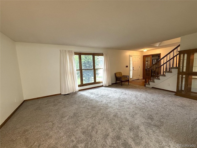 3262 S Salida Way, Aurora, CO 80013 - unfurnished living room with carpet flooring and stairs