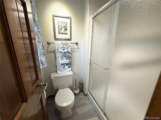 3262 S Salida Way, Aurora, CO 80013 - bathroom with a shower stall and wood finished floors