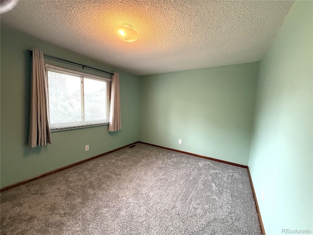3262 S Salida Way, Aurora, CO 80013 - spare room with carpet flooring and a textured ceiling