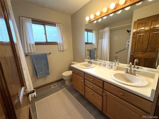 3262 S Salida Way, Aurora, CO 80013 - bathroom with double vanity and a shower with curtain