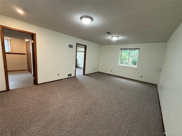 3262 S Salida Way, Aurora, CO 80013 - unfurnished room with a textured ceiling and carpet flooring