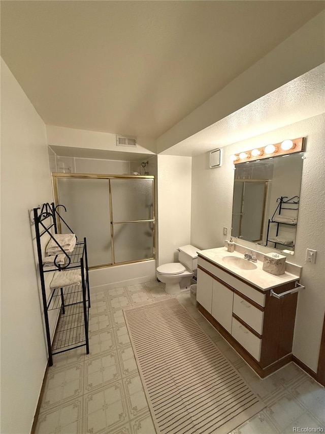 3262 S Salida Way, Aurora, CO 80013 - bathroom featuring vanity, enclosed tub / shower combo, and tile patterned floors