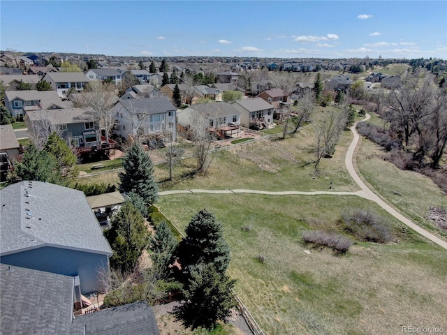 birds eye view of property with a residential view