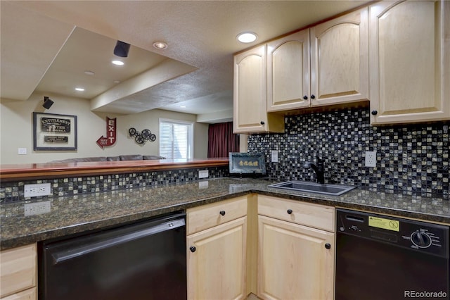 kitchen with a sink, light brown cabinetry, and dishwasher