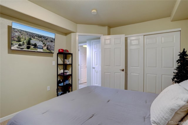 bedroom featuring a closet and baseboards