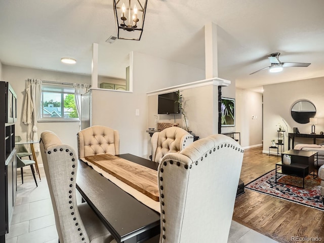 6346 Fenton St, Arvada, CO 80003 - dining area with baseboards, ceiling fan, and a chandelier