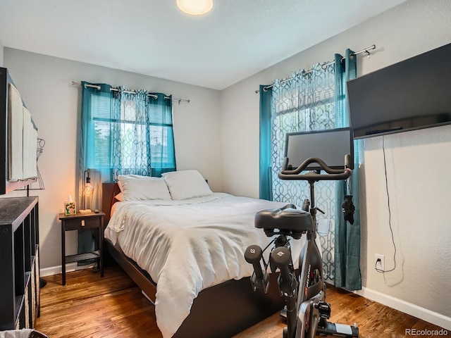 6346 Fenton St, Arvada, CO 80003 - bedroom featuring wood finished floors and baseboards