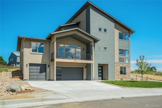 view of front of house with a balcony and a garage