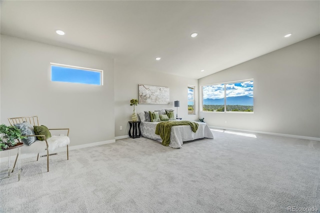 carpeted bedroom featuring lofted ceiling