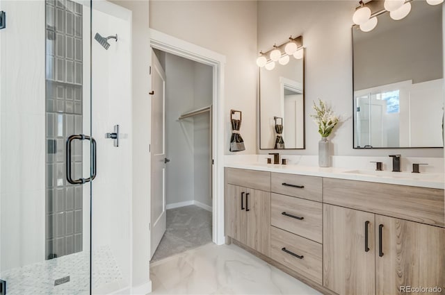 bathroom featuring tile patterned flooring, vanity, and walk in shower