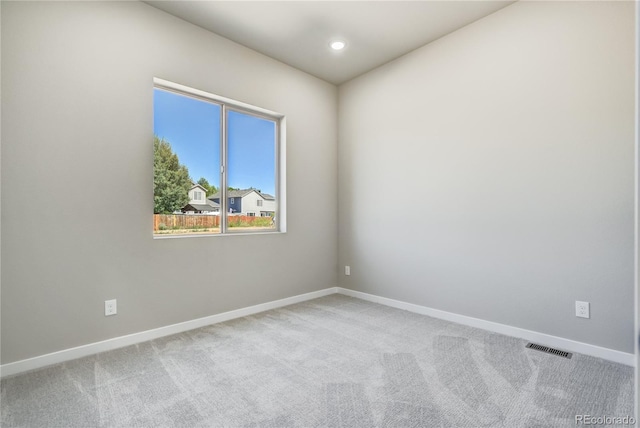 view of carpeted spare room