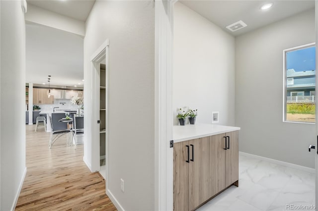 hallway featuring light hardwood / wood-style flooring