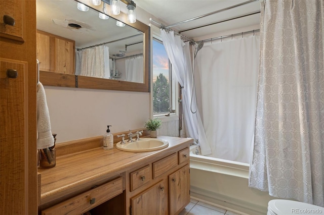 full bathroom with toilet, shower / bath combo, vanity, and tile patterned floors