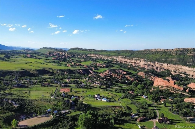 drone / aerial view with a mountain view and a rural view