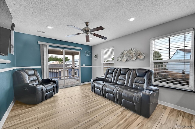 1922 Danube Way, Aurora, CO 80011 - living area with ceiling fan, wood finished floors, a textured ceiling, and recessed lighting