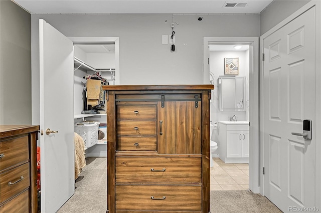 1922 Danube Way, Aurora, CO 80011 - walk in closet with light carpet and light tile patterned floors