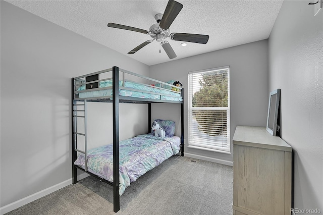 1922 Danube Way, Aurora, CO 80011 - carpeted bedroom with a textured ceiling and a ceiling fan