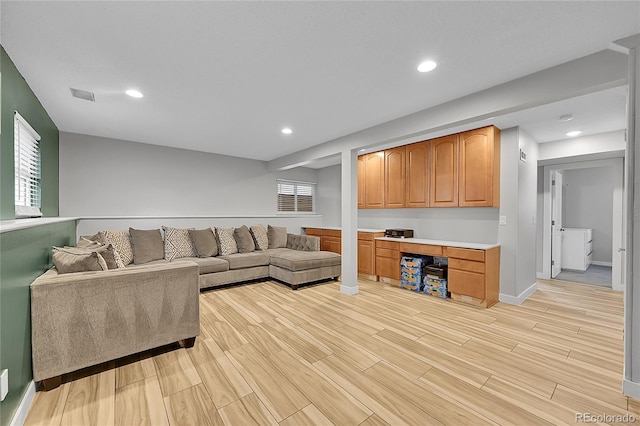 1922 Danube Way, Aurora, CO 80011 - living room featuring light wood-type flooring and recessed lighting