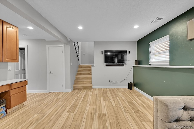 1922 Danube Way, Aurora, CO 80011 - unfurnished living room with light wood-type flooring and recessed lighting