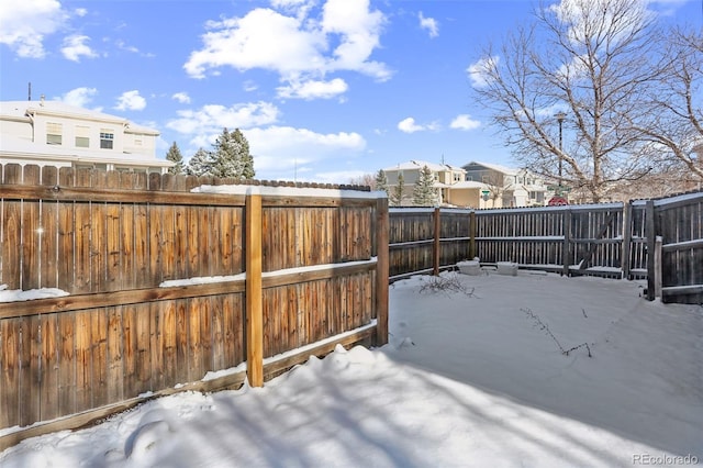 view of yard layered in snow