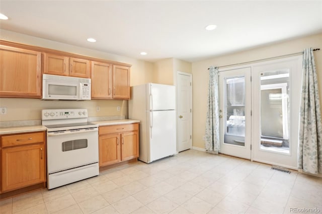 kitchen featuring a healthy amount of sunlight and white appliances