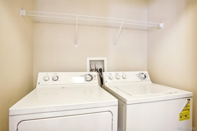 washroom with washer and clothes dryer