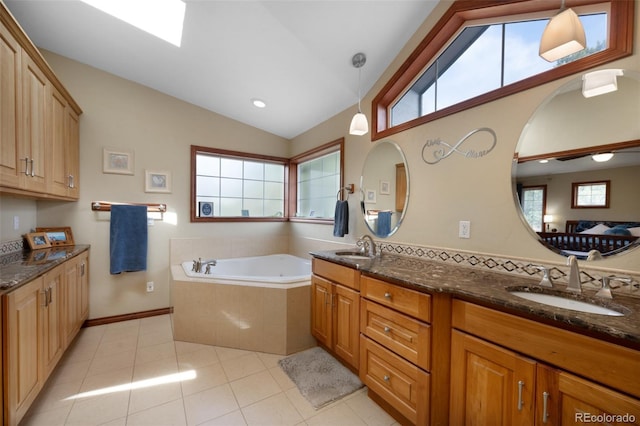 6535 Arequa Ridge Ln, Colorado Springs, CO 80919 - full bathroom featuring a bath, tile patterned flooring, a sink, and lofted ceiling