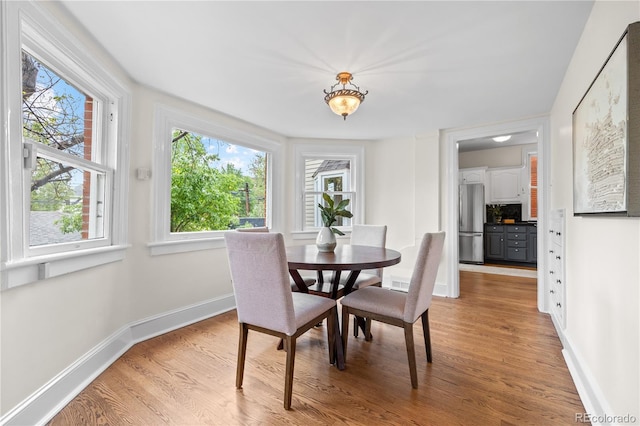963 N Lafayette St, Denver, CO 80218 - dining room featuring light wood-style floors and baseboards