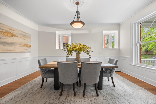 963 N Lafayette St, Denver, CO 80218 - dining space featuring crown molding, a wainscoted wall, and wood finished floors