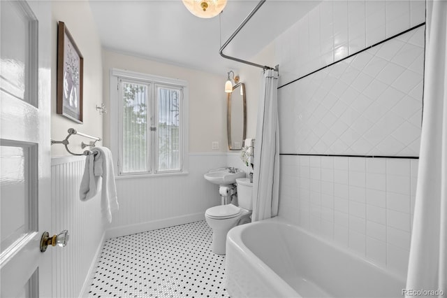 963 N Lafayette St, Denver, CO 80218 - full bathroom with wainscoting and shower / bath combo with shower curtain