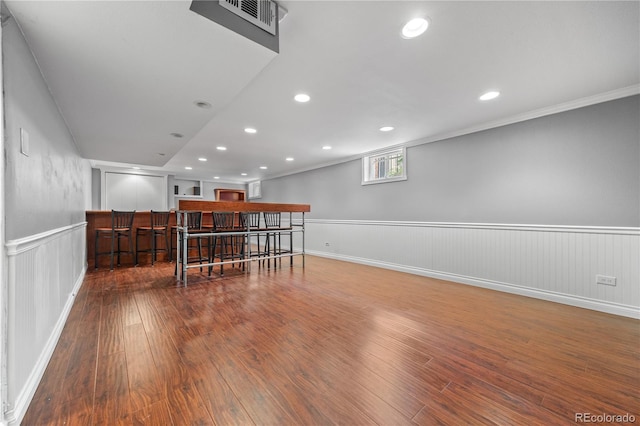 963 N Lafayette St, Denver, CO 80218 - below grade area featuring wood finished floors, a wainscoted wall, recessed lighting, baseboards, and crown molding
