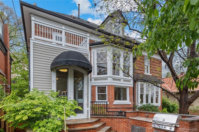 963 N Lafayette St, Denver, CO 80218 - view of front facade featuring brick siding