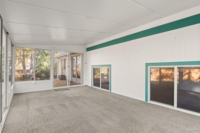 unfurnished sunroom featuring lofted ceiling