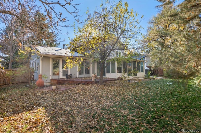 view of front of house with a sunroom