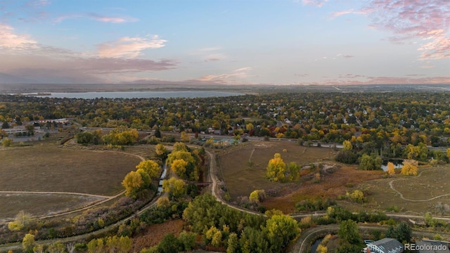 aerial view at dusk with a water view
