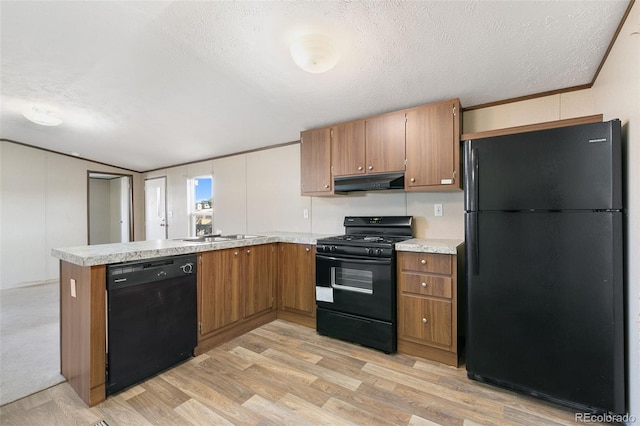 kitchen with ventilation hood, kitchen peninsula, a textured ceiling, black appliances, and light wood-type flooring