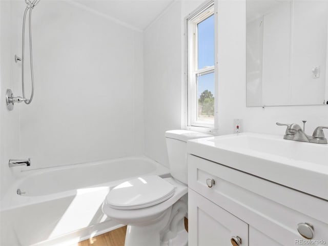 full bathroom featuring washtub / shower combination, vanity, toilet, hardwood / wood-style flooring, and crown molding