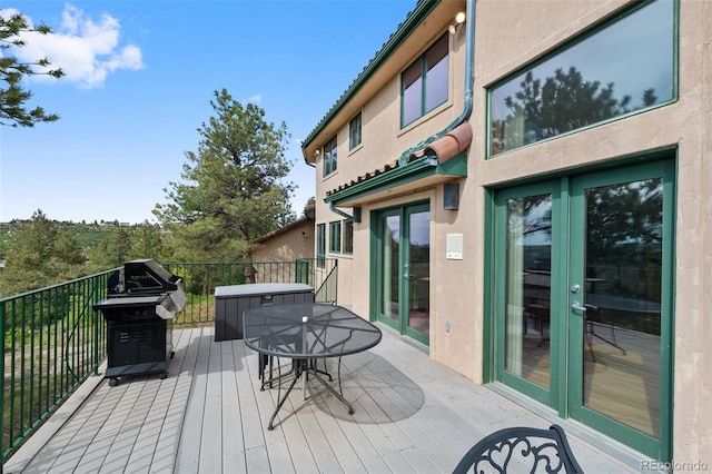 857 Pawnee Trl, Castle Rock, CO 80108 - deck with french doors, outdoor dining area, and grilling area