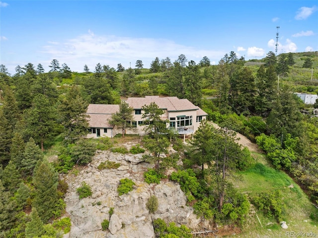 857 Pawnee Trl, Castle Rock, CO 80108 - aerial view of property and surrounding area with a heavily wooded area
