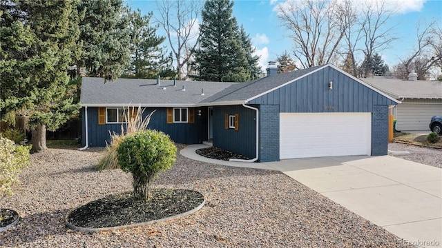 ranch-style house featuring concrete driveway, an attached garage, and brick siding