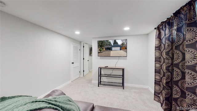 sitting room featuring carpet flooring, recessed lighting, and baseboards