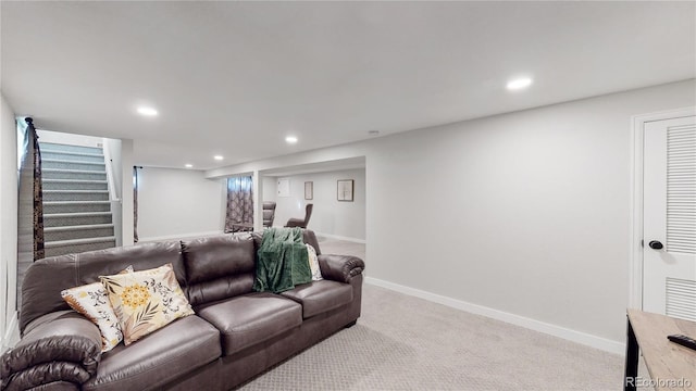 living area featuring recessed lighting, baseboards, light carpet, and stairs