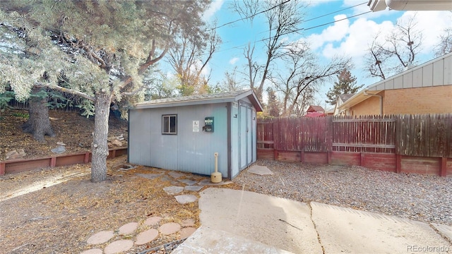 view of shed with fence