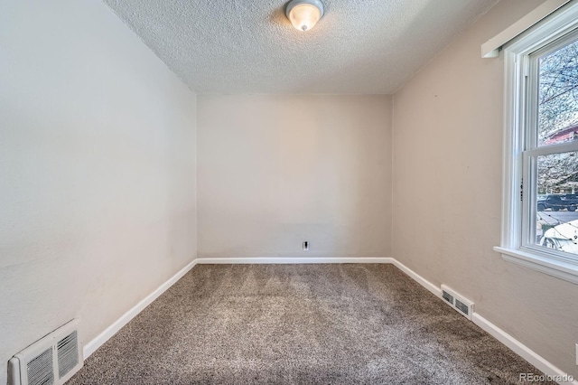 1746 Galena St, Aurora, CO 80010 - carpeted empty room featuring a textured ceiling and baseboards