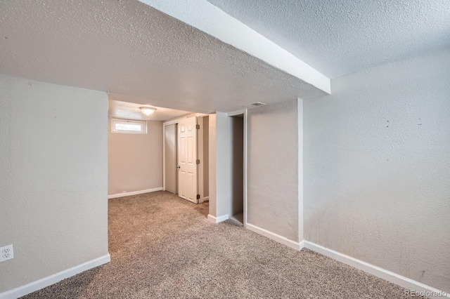 1746 Galena St, Aurora, CO 80010 - basement with a textured ceiling, carpet flooring, baseboards, and a textured wall