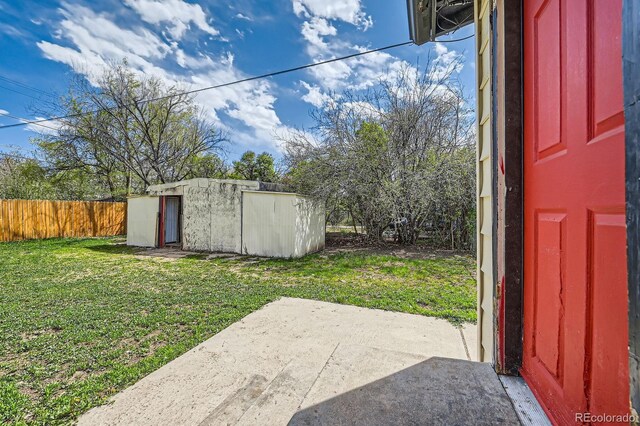 1746 Galena St, Aurora, CO 80010 - view of yard with a storage shed, a patio area, and an outbuilding