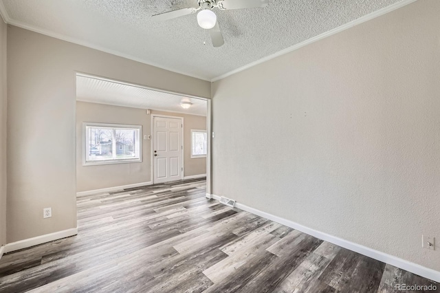 1746 Galena St, Aurora, CO 80010 - unfurnished room featuring a textured ceiling, ceiling fan, wood finished floors, crown molding, and baseboards